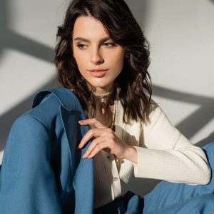 pretty-brunette-woman-with-blue-jacket-looking-awa-F69ED93.jpeg